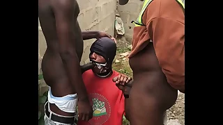 Step Dad and step nipper and band together giving them blowjob behind a fence wall